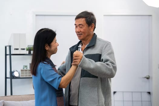 Holding hands, hug or happy old couple dancing for love, support or trust in marriage at home together.