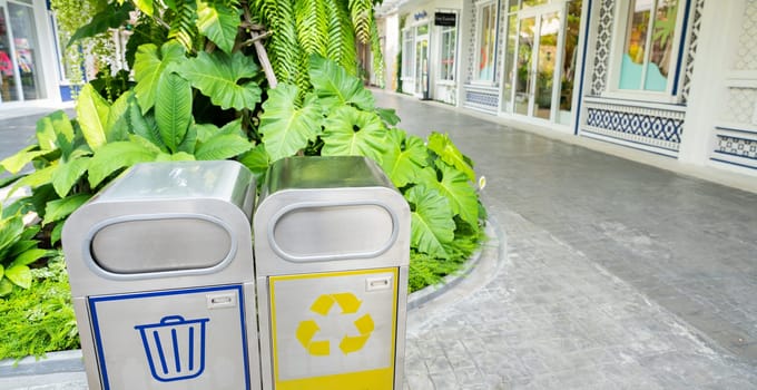 Public area trash bins for sustainable waste management. Sustainable living. Recycling bins at shopping center. Eco-friendly disposal. Environmental conservation. Garbage bins. Recycling concept.