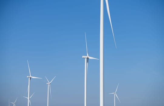 Wind energy. Wind power. Sustainable, renewable energy. Wind turbines generate electricity. Wind farm. Sustainable resources. Sustainable development. Green technology for energy sustainability.