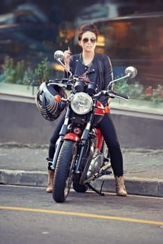 Motorcycle, leather and woman in city with cigarette for travel, transport or road trip as rebel. Fashion, street and smoke with model on classic or vintage bike for transportation or journey.