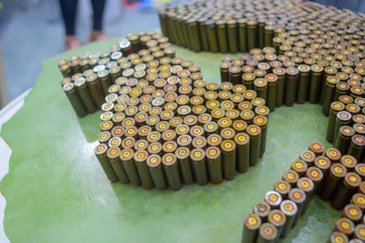 Object made up of spent used cartridge cases. Lots used shells from cartridge cases ammo close up. Model from Many Used cartridge Cases. Concept war military confrontation defense protection firearm