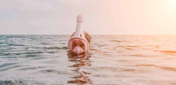 Young happy woman in white bikini put pink snorkeling mask on beach before swimming. girl having fun relaxing on beautiful beach. Beach lifestyle