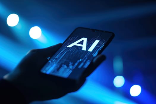 Hand holding smartphone with artificial intelligence AI letters on screen. Generative AI.