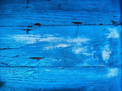 texture of old wooden boards covered in blue paint. Abstract background, frame, place for text and copy space
