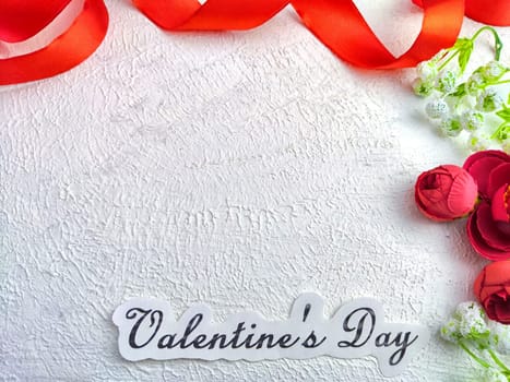 White background, flowers, red ribbon and Valentine's Day inscription. Concept of holiday. Card, Background, Texture, Frame, copy space, place for text