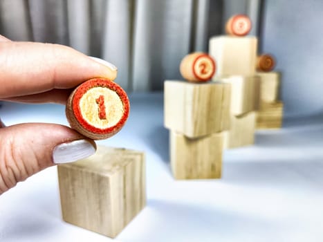 Small wooden cubes in columns, lined up in row and with numbers. Concept of stages of achieving goal. The need for the first step for the successful development and implementation of the project