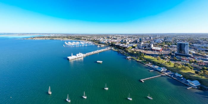 Views from Port Phillip Bay towards Geelong CBD and city on a warm summer evening in Geelong, Victoria, Australia