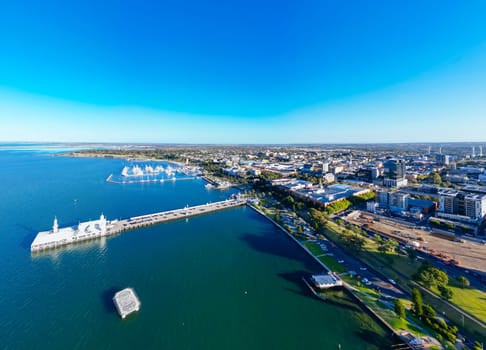 Views from Port Phillip Bay towards Geelong CBD and city on a warm summer evening in Geelong, Victoria, Australia