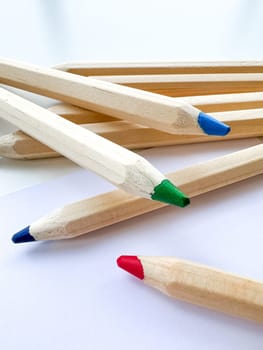 Wooden colorful ordinary pencils isolated on a white background. High quality photo