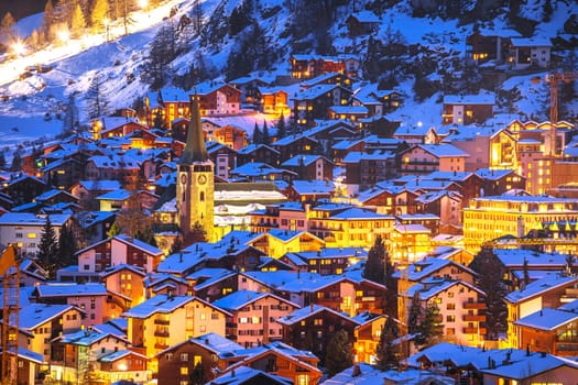 Idyllic village of Zermatt rooftops evening view, luxury winter destination in Switzerland
