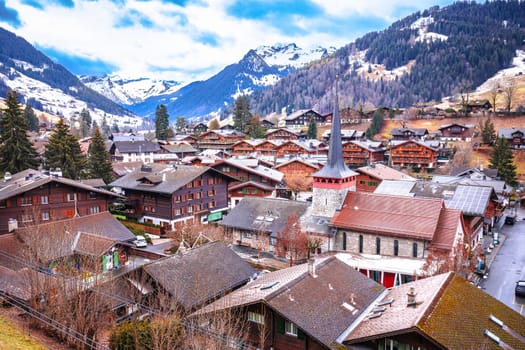 Idyllic village of Gstaad rooftops view, luxury winter destination in Switzerland