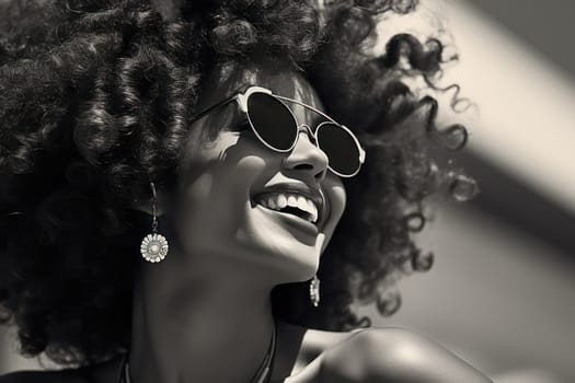Happy Afro-American Woman with Curly Hair, Smiling and Posing in Trendy Sunglasses against Bright Colorful Background