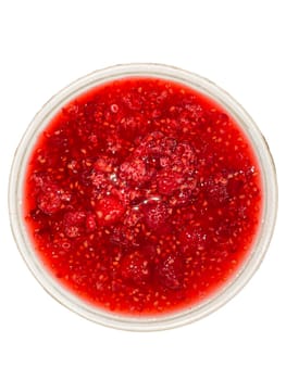 raspberry jam in a cup on a white background.