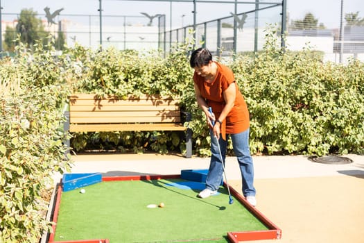 Minigolf player detail on green grass. High quality photo