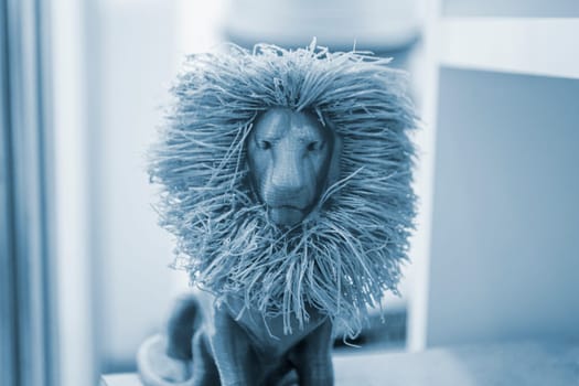 Art object model of lion printed on 3D printer. Lion toy created by 3D printing from molten plastic. Example of creating prototype by 3D printer. Concept 3D printing. 3D printing innovation technology