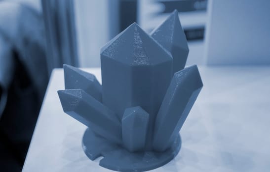 Art object model of crystals printed on 3D printer. Toy created by 3D printing from molten plastic. Example of creating prototype by 3D printer. Concept 3D printing. 3D printing innovation technology
