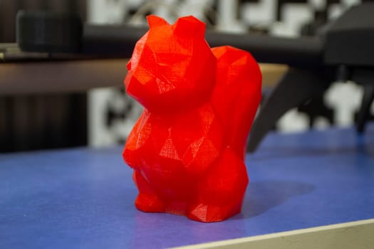 Art object model of squirrel printed on 3D printer. Toy created by 3D printing from molten plastic. Example of creating prototype by 3D printer. Concept 3D printing. 3D printing innovation technology