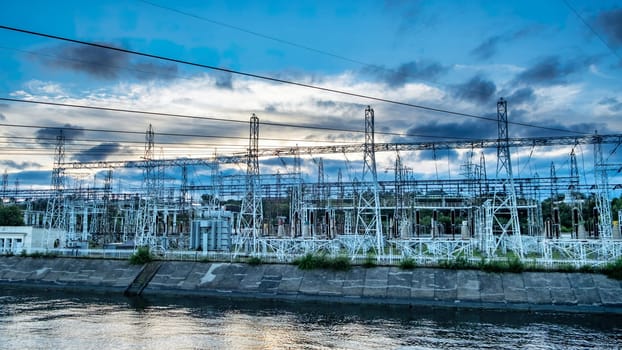 electricity pylons in transformer substation with a beautiful sunset sky. download image