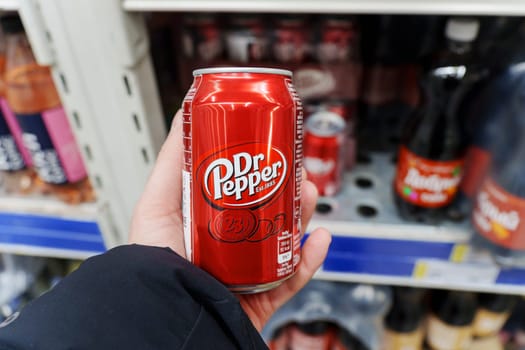 Tyumen, Russia-December 11, 2023: Dr. Pepper is a soft drink marketed as having a unique flavor. The drink was created in the 1880s.