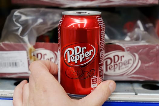 Tyumen, Russia-December 11, 2023: Dr Pepper is a soft drink marketed as having a unique flavor.