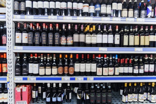 Tyumen, Russia-December 11, 2023: Metro Cash Carry Supermarket. A showcase with wine in the assortment.