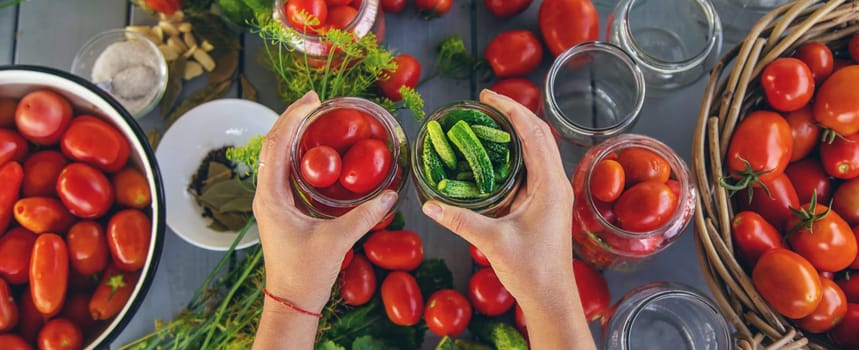 Preserving tomatoes in jars. Selective focus. Food.