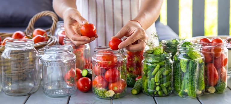 Preserving tomatoes in jars. Selective focus. Food.