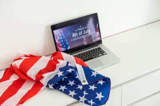 Independence Day celebration after quarantine. laptop with inscription independence day. High quality photo
