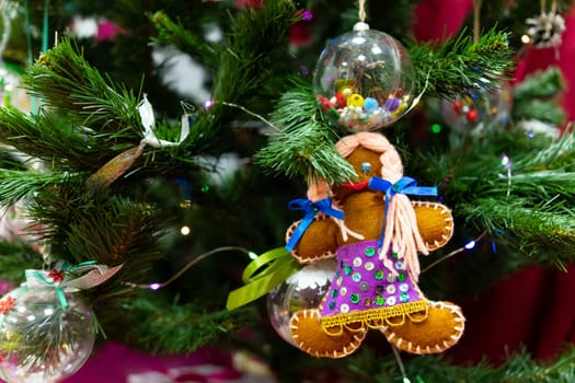 Christmas decoration on the Christmas tree. A handmade Christmas tree decoration hangs on the Christmas tree