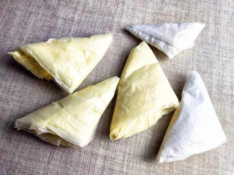 Plastic bag folded into triangle for storage. Ways of storing and laying at home