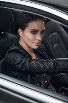 Woman, car and view while driving on a journey or adventure in a luxury vehicle. Female person, roadtrip and steering wheel of a transportation motor for confidence on a travel destination trip.