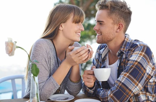Couple, morning and drinking coffee on holiday and love in outdoors, romance and hot tea on vacation. People, bonding and breakfast for relaxation, commitment and loyalty to marriage or relationship.