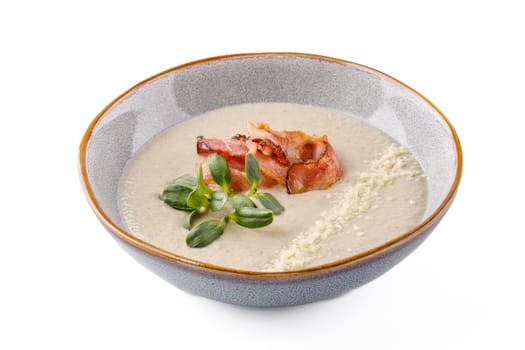Cream of mushroom soup with bacon on a white background studio food photo 1