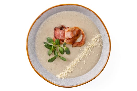 Cream of mushroom soup with bacon on a white background studio food photo