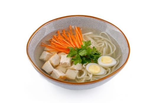 Chicken soup with homemade noodles on a white background studio shot 4