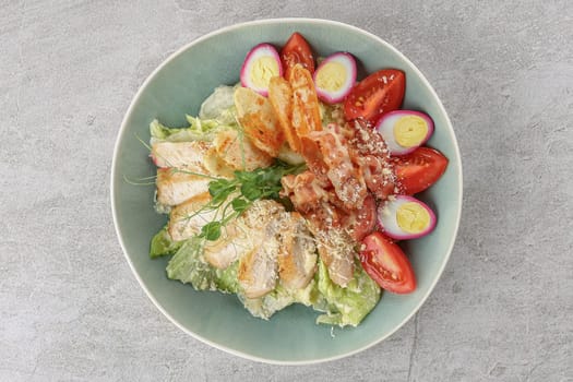 Caesar salad with smoked salmon and pickled eggs on a stone background, studio food photography 5