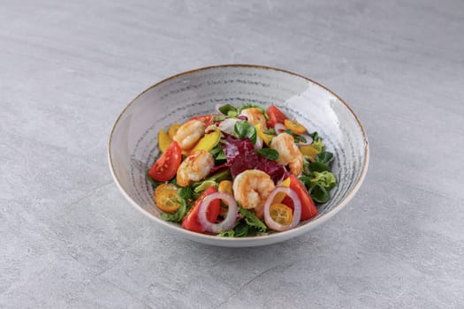 bowl with avocado shrimp and kumquat on stone background, studio food photography 1