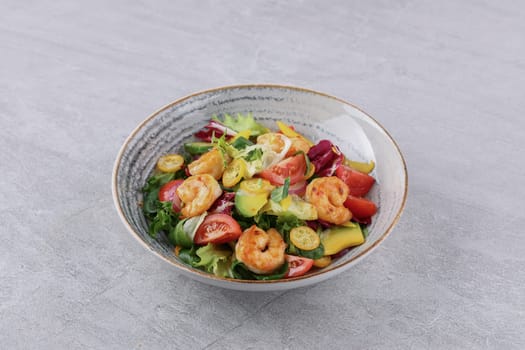 bowl with avocado shrimp and kumquat on stone background, studio food photography 3
