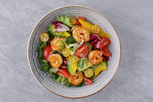 bowl with avocado shrimp and kumquat on stone background, studio food photography 4