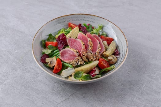 salad with carpaccio, artichoke and asparagus on a stone background, studio food photography 4