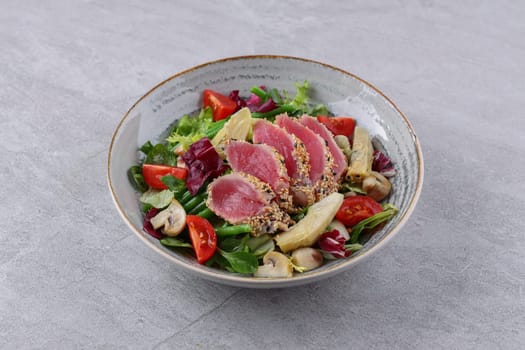 salad with carpaccio, artichoke and asparagus on a stone background, studio food photography 3