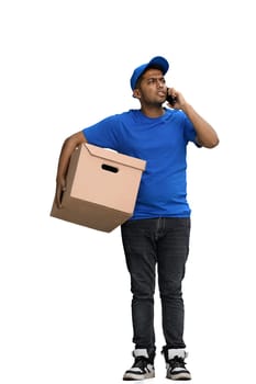 A man on a white background with box conversate on the phone.