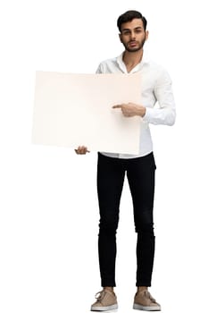 man on a white background in full growth holding a white sheet of paper copy spice.