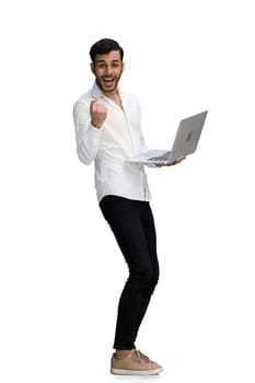 man on a white background. uses a computer.