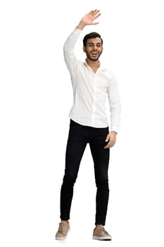 a full-length man on a white background waves hello.