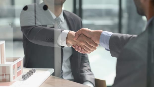 Close up of handshake in the office