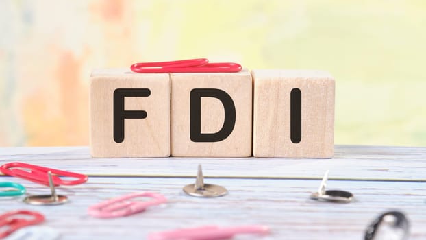 Word FDI written on wooden cubes stock image.