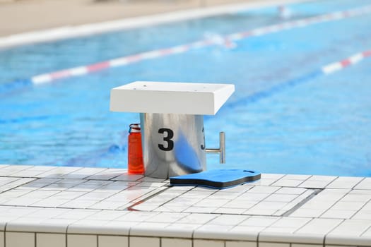 Starting blocks ready to dive into the pool