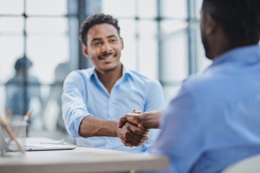 Business professionals in a successful meeting, displaying teamwork and collaboration.