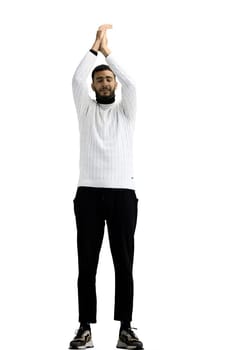 A man, full-length, on a white background, claps.